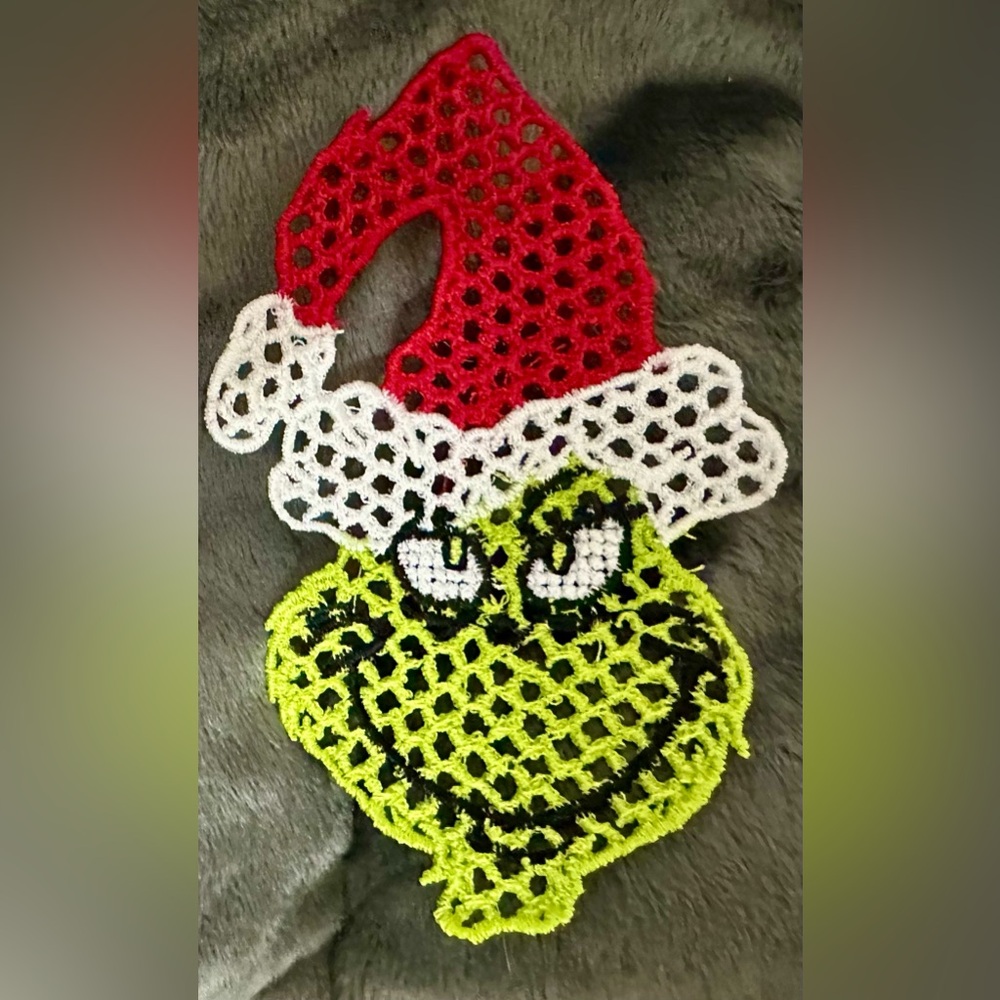 Handcrafted Embroidered Free Standing Lace Ornament green guy with Santa Hat.